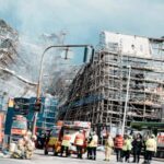 firefighters-tackle-scaffolding-dangling-outside-ruins-of-fire-ravaged-danish-landmark
