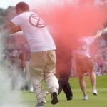 six-climate-protesters-run-onto-18th-green-and-spray-powder,-delaying-finish-of-pga-tour-event