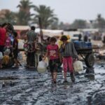 in-the-searing-heat-of-the-gaza-summer,-palestinians-are-surrounded-by-sewage-and-garbage