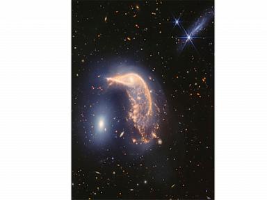 webb-space-telescope’s-captures-pair-of-intertwined-galaxies-glowing-in-infrared