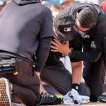 plate-umpire-nick-mahrley-exits-game-between-rockies-and-yankees-after-broken-bat-hits-his-neck