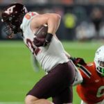 no.-7-miami-survives-virginia-tech-38-34-to-remain-unbeaten-after-hail-mary-td-overturned