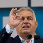 hungary’s-orban-interrupted-by-activist-during-eu-presidency-news-conference