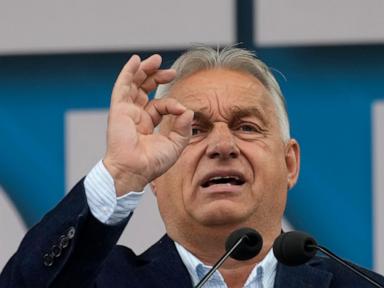 hungary’s-orban-interrupted-by-activist-during-eu-presidency-news-conference
