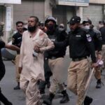 pakistani-police-fire-tear-gas-and-charge-protesters-in-karachi