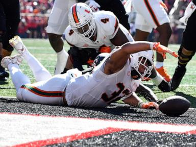 cam-ward-throws-for-4-touchdowns,-no.-6-miami-survives-louisville-comeback-bids-for-wild-52-45-win