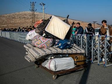 hundreds-of-syrians-line-up-at-turkish-border-crossing,-awaiting-return-home