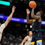 kam-jones-has-his-fifth-double-double-to-lead-no.-21-marquette-past-georgetown-76-61