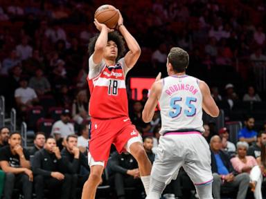 bub-carrington-hits-game-winner-as-time-expires-to-lift-wizards-past-play-in-bound-heat-119-118