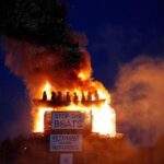 burning-of-migrant-boat-effigy-in-northern-ireland-triggers-police-investigation