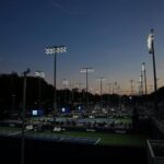 at-the-us-open,-tennis-stars-shine-under-dark-sky-friendly-outdoor-lights