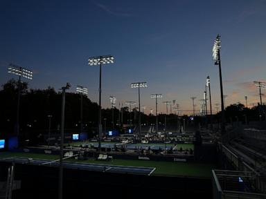 at-the-us-open,-tennis-stars-shine-under-dark-sky-friendly-outdoor-lights