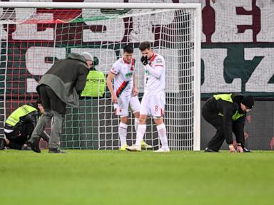 fan-protest-against-kickoff-times-interrupts-bundesliga-game-between-augsburg-and-union-berlin
