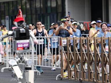 humanoid-robot-sprints-to-victory-in-beijing,-beating-human-half-marathon-record
