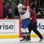 mackinnon-takes-a-puck-from-an-avs-teammate-to-the-face