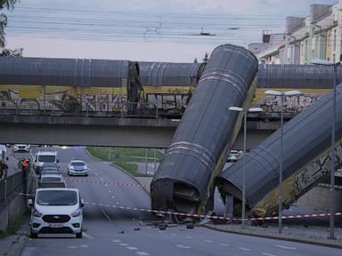2-freight-trains-collide-in-germany,-sending-2-wagons-plunging-off-bridge;-1-dead